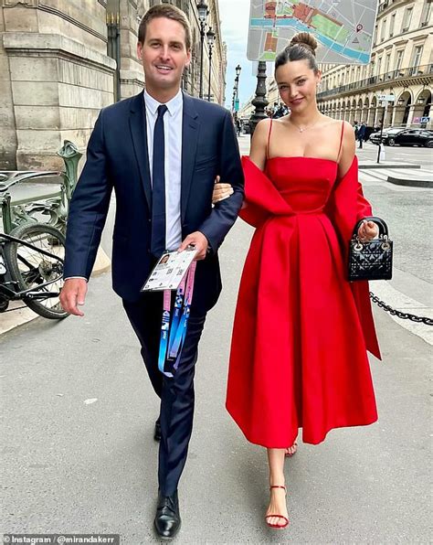 Miranda Kerr stuns in a ,500 Dior red gown paired with ,000 